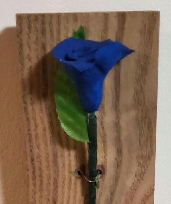 Clay Rose on Wooden Background